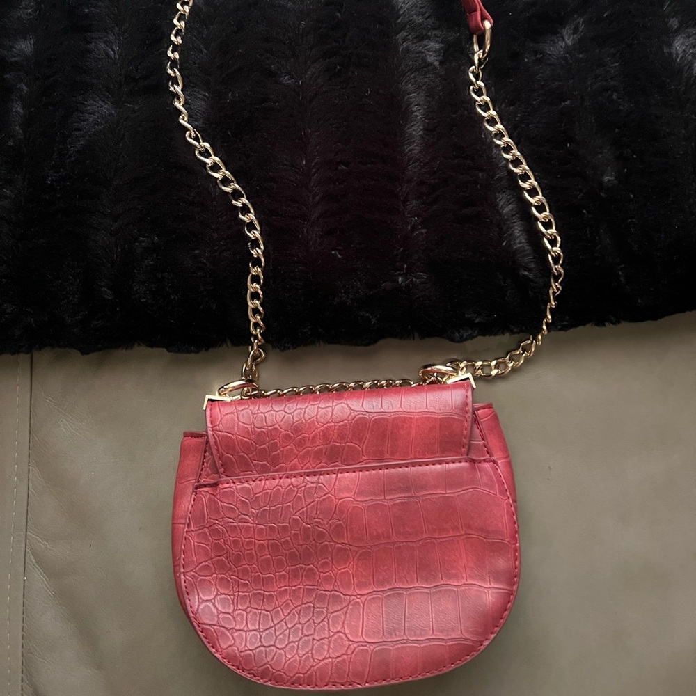 New Bebe red crossbody purse. Never carried in perfect condition priced to sell